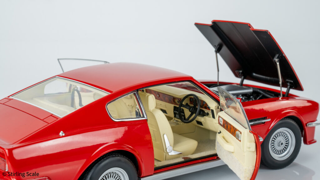 A gloved hand inspecting the V8 Vantage model